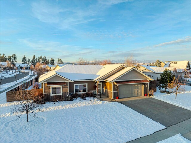 115 Stryker Peak Trl, Kalispell, MT 59901 - single story home with an attached garage and asphalt driveway