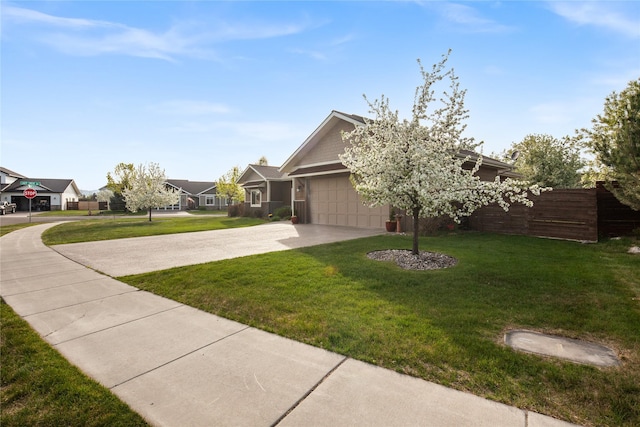 115 Stryker Peak Trl, Kalispell, MT 59901 - view of front of property with driveway, a front yard, an attached garage, and a residential view