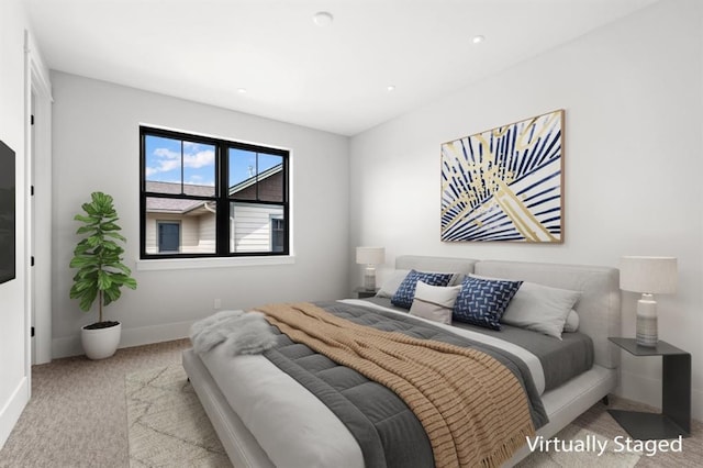 bedroom featuring light colored carpet