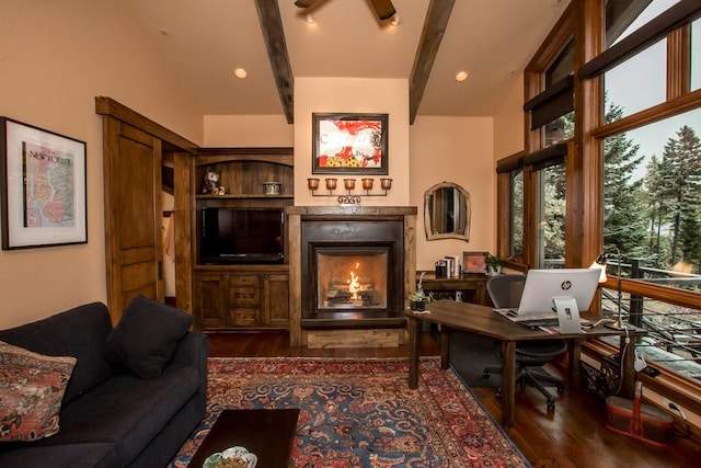 interior space with beam ceiling, dark hardwood / wood-style floors, and ceiling fan