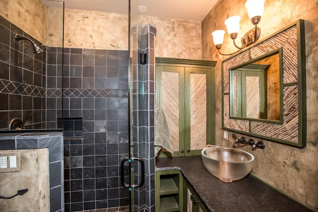 bathroom with sink and a shower with shower door