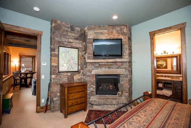 carpeted living room featuring a fireplace