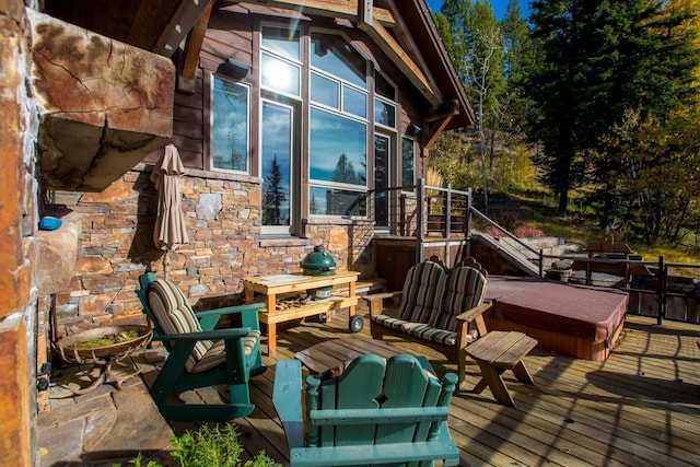 deck with a covered hot tub