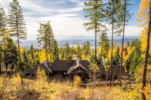 back of house featuring a mountain view