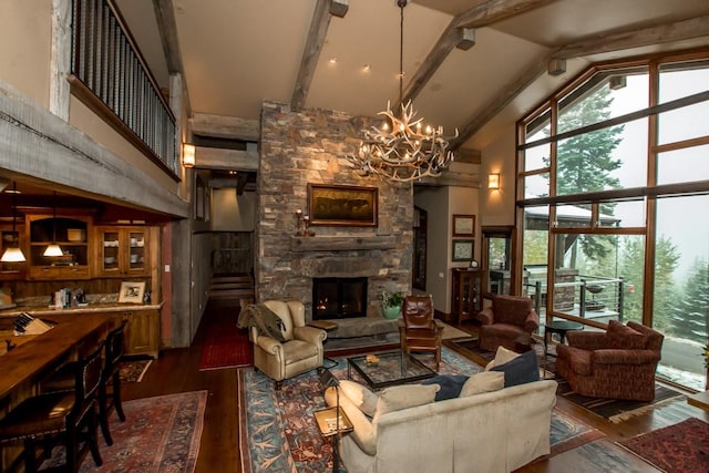 living room featuring beam ceiling, dark hardwood / wood-style floors, a fireplace, and high vaulted ceiling