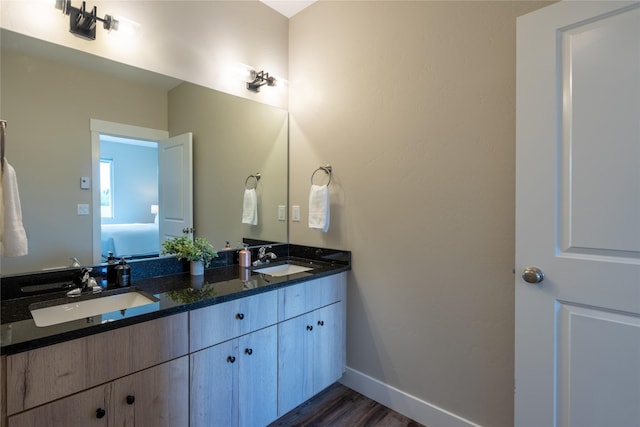 bathroom featuring vanity and hardwood / wood-style floors