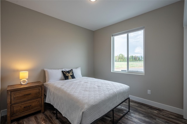 bedroom featuring dark wood-type flooring