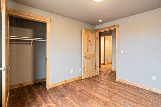 bathroom featuring wood-type flooring and sink