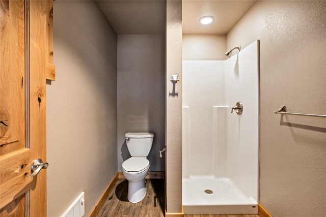 bedroom featuring sink and hardwood / wood-style flooring