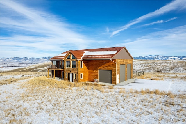 view of front of house with a garage and a mountain view