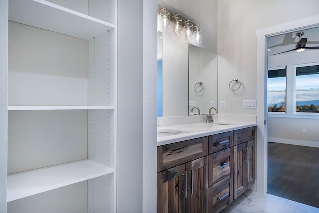 bathroom featuring ceiling fan and vanity