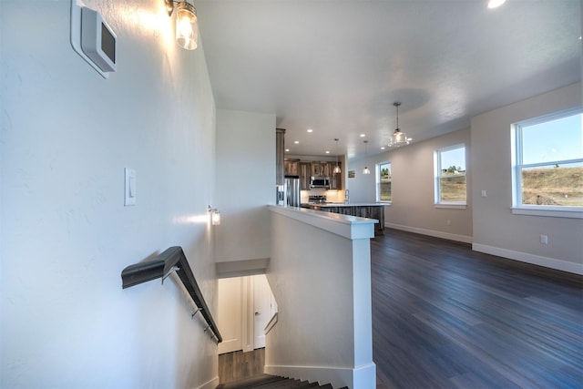 staircase featuring hardwood / wood-style floors