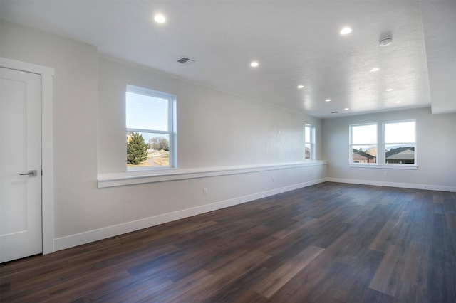 unfurnished room featuring dark wood-type flooring