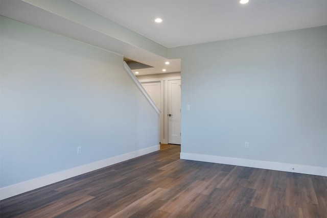 unfurnished room featuring dark hardwood / wood-style flooring