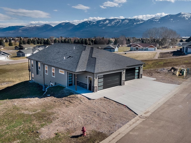 view of front of house featuring a mountain view and a garage