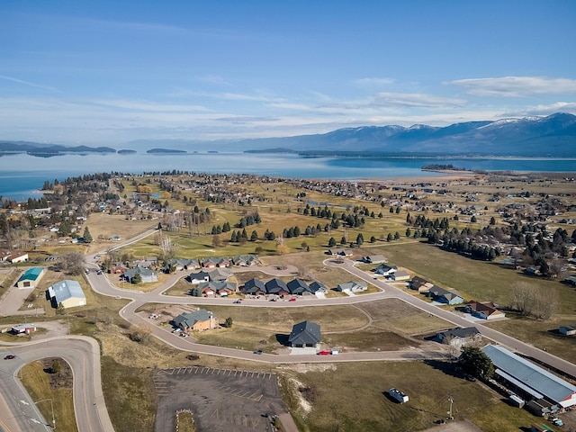 aerial view featuring a water and mountain view