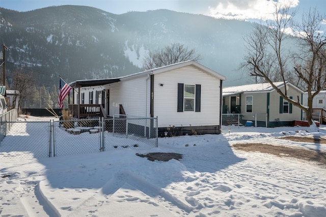 view of front facade featuring a mountain view and covered porch