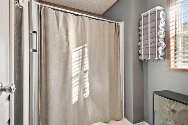 bathroom featuring a textured ceiling