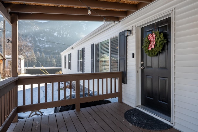 wooden terrace featuring a mountain view