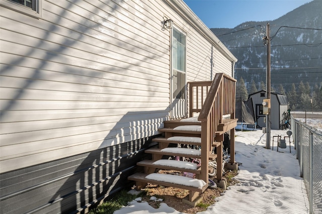 exterior space featuring a shed and a mountain view