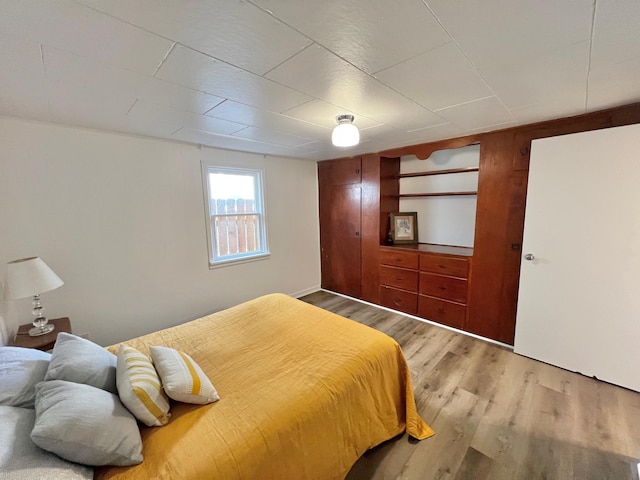 bedroom with light wood-style floors