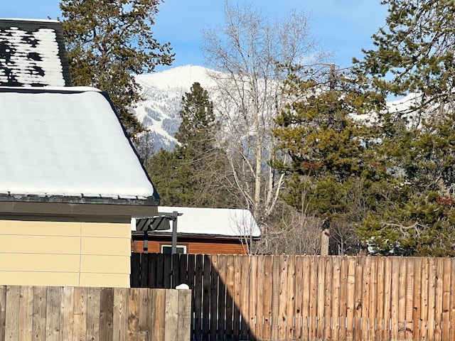 view of yard with a mountain view and fence