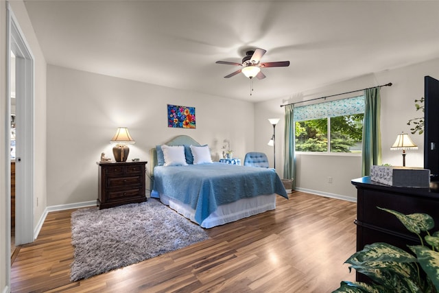 bedroom with ceiling fan and hardwood / wood-style floors