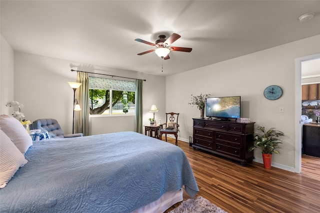 bedroom featuring ceiling fan and dark wood-type flooring