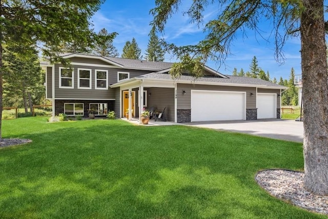 view of front facade with a front yard and a garage