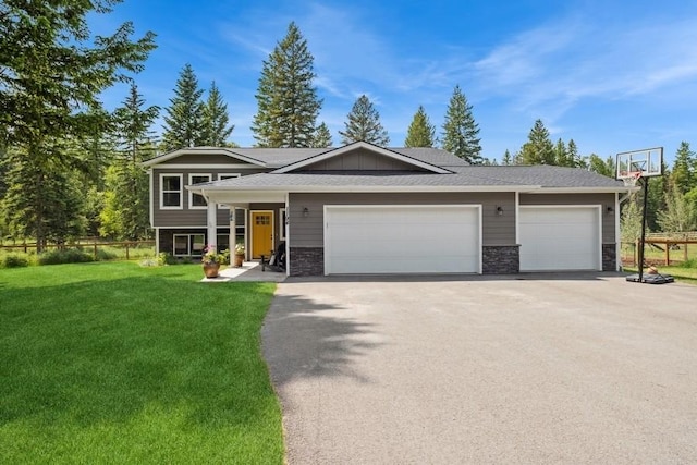 view of front of home with a garage and a front yard