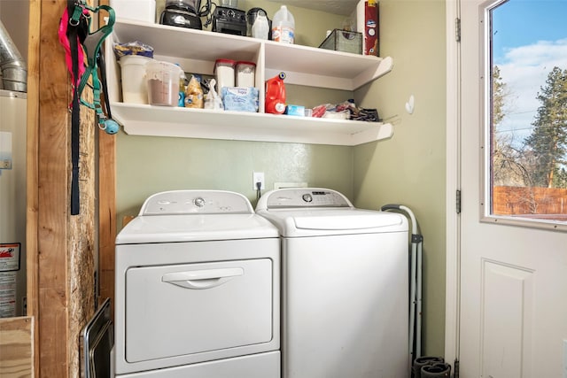 laundry area with plenty of natural light and washer and clothes dryer