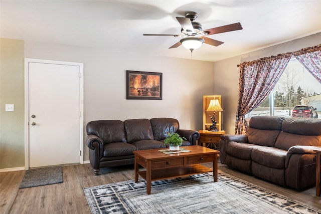 living room with ceiling fan and hardwood / wood-style floors