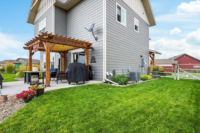 back of house with a lawn, central AC, a pergola, and a patio