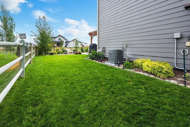 view of yard with central air condition unit