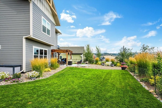 view of yard with a pergola and a patio area