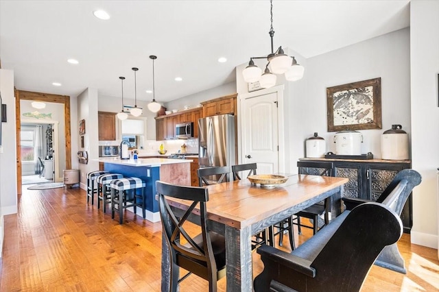 dining room with light hardwood / wood-style floors