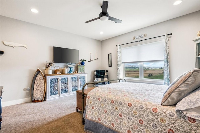 bedroom with ceiling fan and light carpet