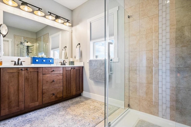 bathroom with vanity and an enclosed shower