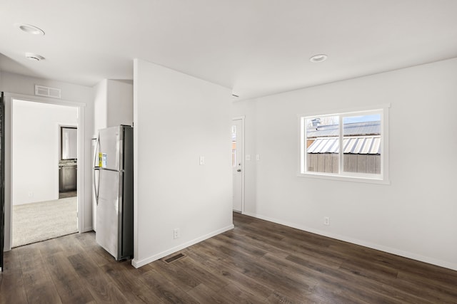 unfurnished room featuring dark hardwood / wood-style flooring