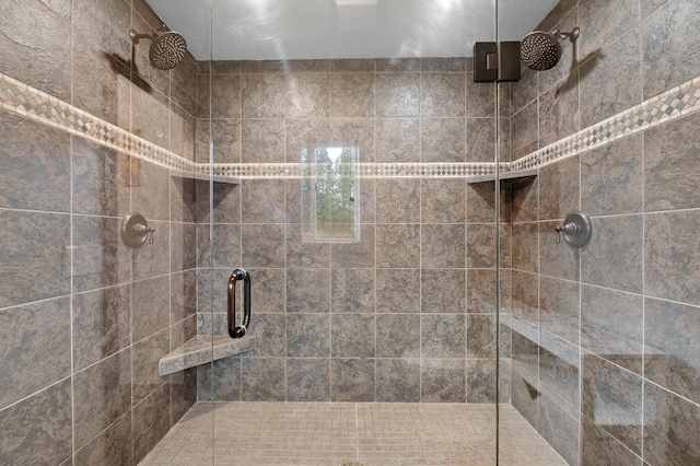 bathroom with a shower with shower door