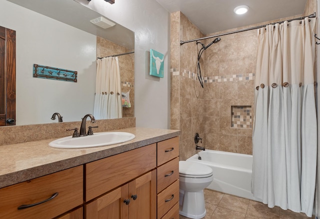 full bathroom with shower / bath combo with shower curtain, tile patterned floors, toilet, and vanity