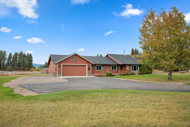 single story home with a garage and a front yard