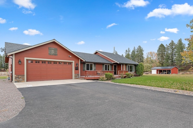 ranch-style house with a garage, a porch, and a front yard