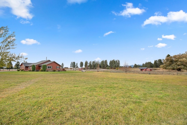 view of yard with a rural view