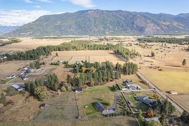 birds eye view of property with a mountain view and a rural view