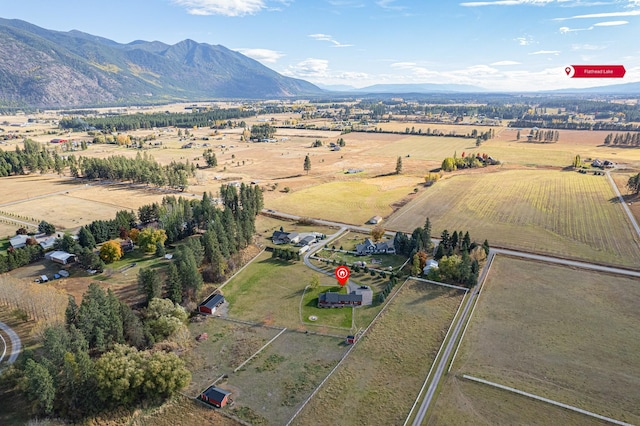 drone / aerial view featuring a rural view and a mountain view