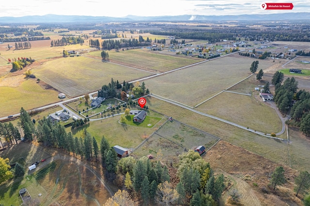 bird's eye view featuring a rural view and a mountain view