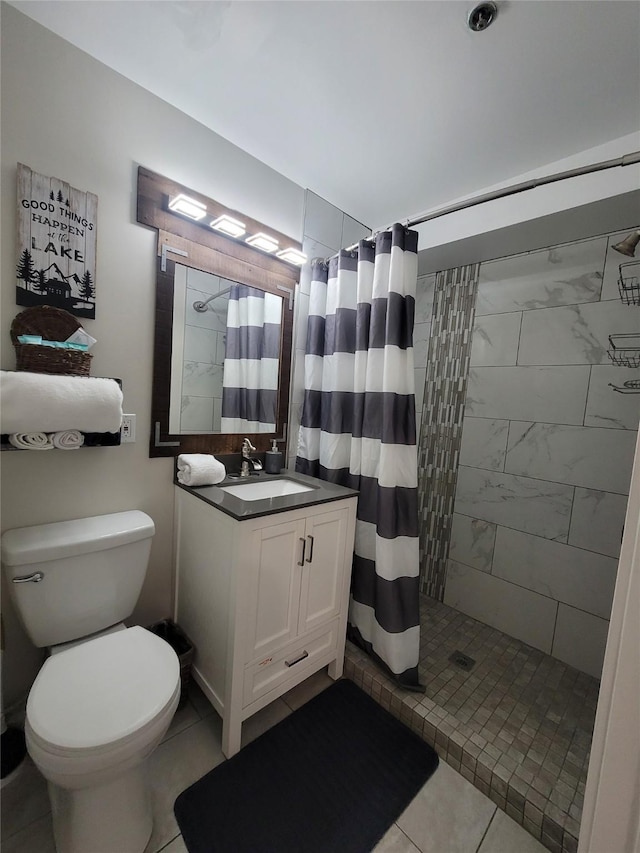 bathroom featuring walk in shower, vanity, tile patterned floors, and toilet