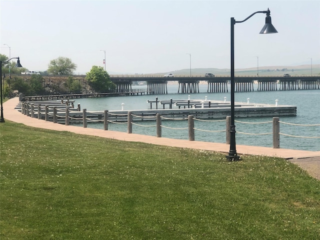 exterior space with a water view and a yard