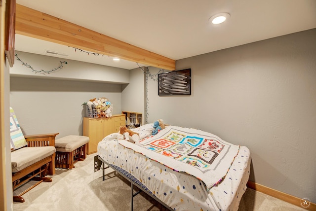 carpeted bedroom featuring beam ceiling